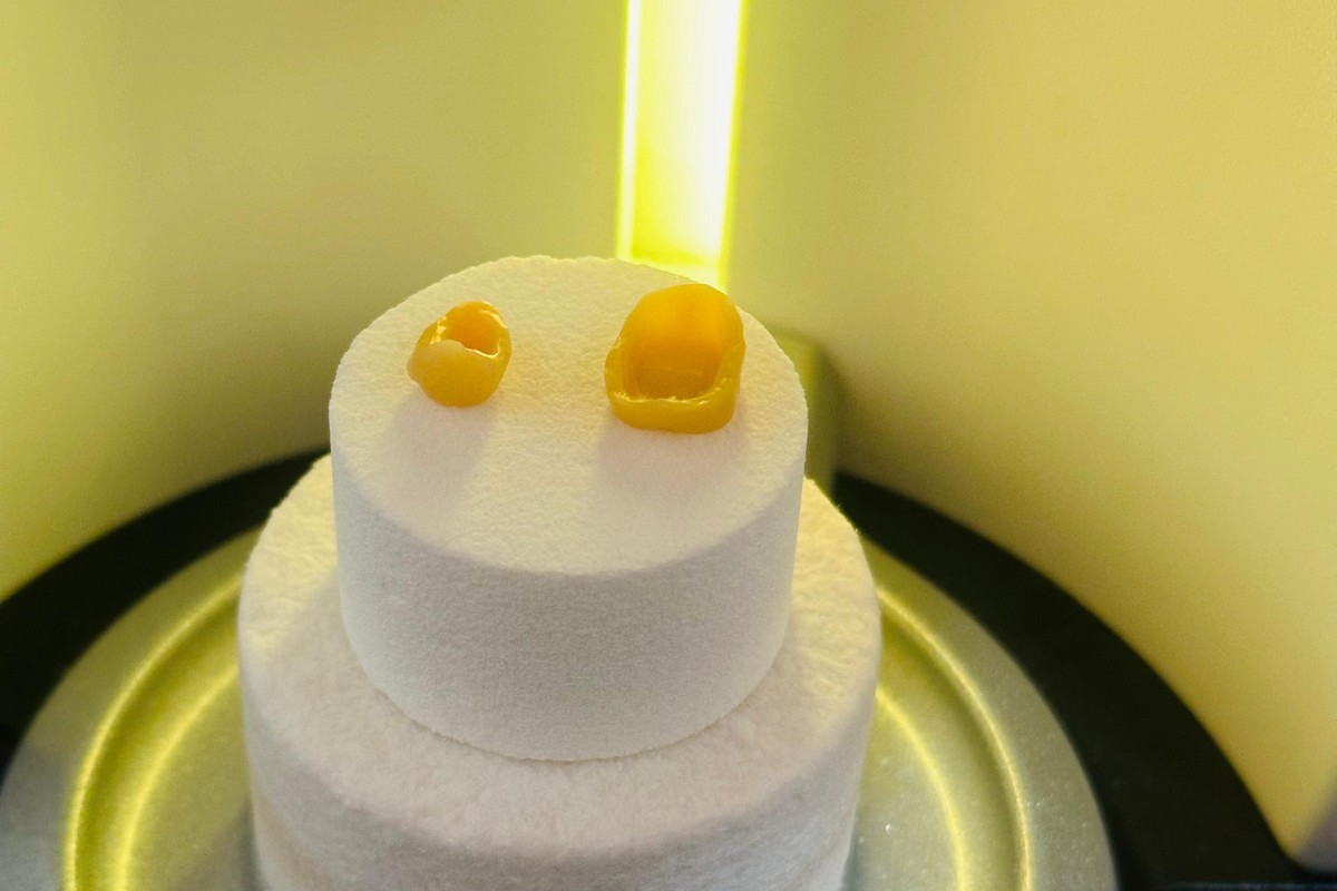 A milled ceramic restoration in the CEREC Speedfire furnace at Calm Dental, glowing as it is fired